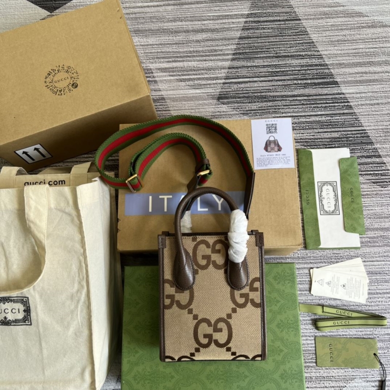 G*u*i top handle bags